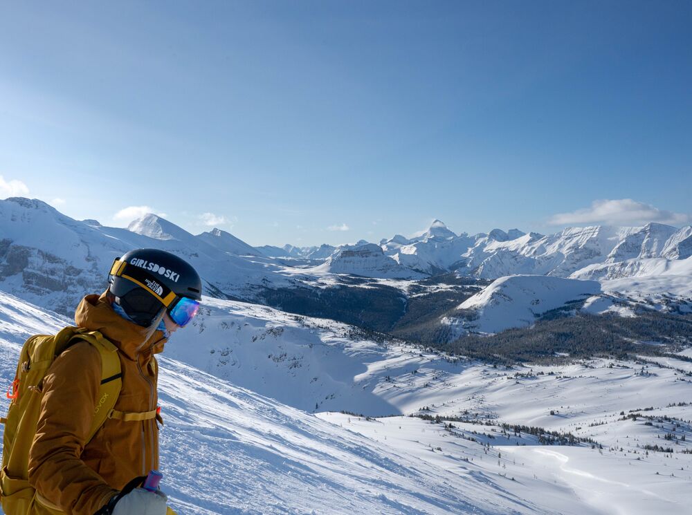 A skier looks out over the South Divide ski run at Banff Sunshine Village in Banff National Park.